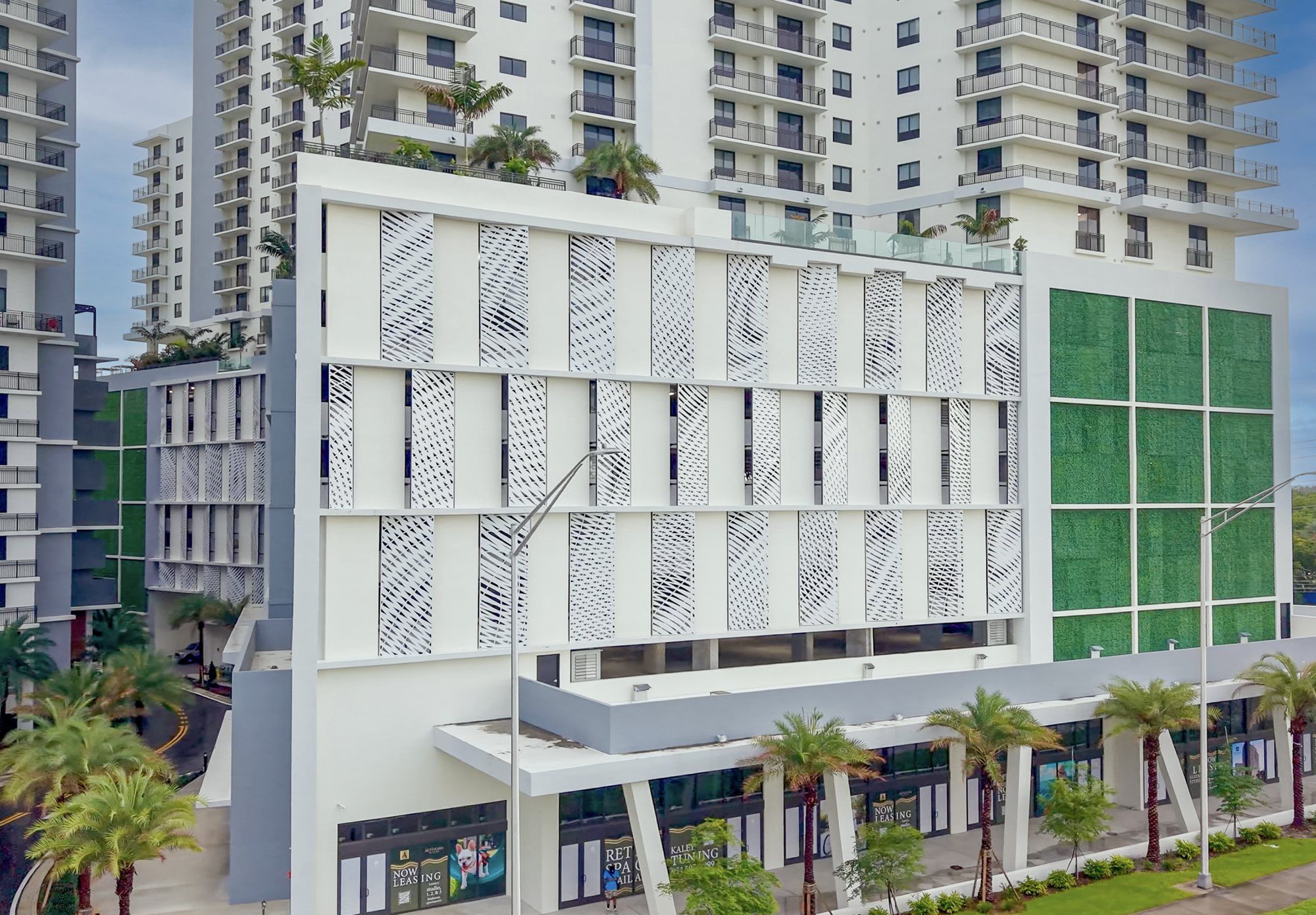 Ebb and Flow, patterned louver panels screening the parking podium of Alvorada on the Bay, North Miami Beach, seen head-on